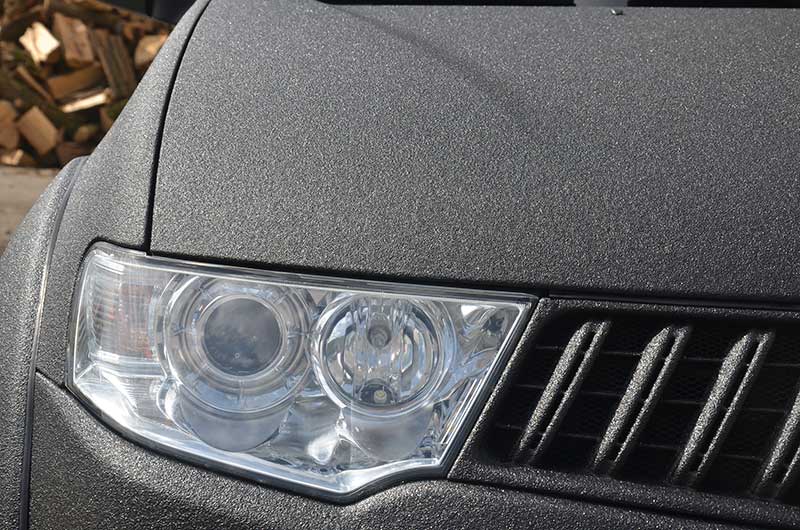 Работа компании «Армлайн»: защита кузова внедорожника Mitsubishi Pajero Sport полимерным покрытием Line-X от механических повреждений и коррозии.