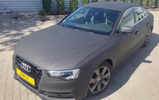 Защита кузова седана Audi A5 от механических повреждений и коррозии полимерным покрытием line-X черного цвета