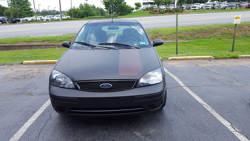 Защита кузова автомобиля Ford Focus полимерным покрытием Line X от ударов, царапин и коррозии